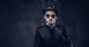 magician-showing-trick-with-playing-cards-3